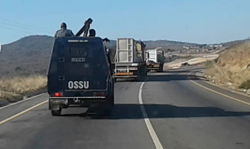 The Operational Support Service Unit of the Royal Eswatini Police escorts the rhinos to their destination.